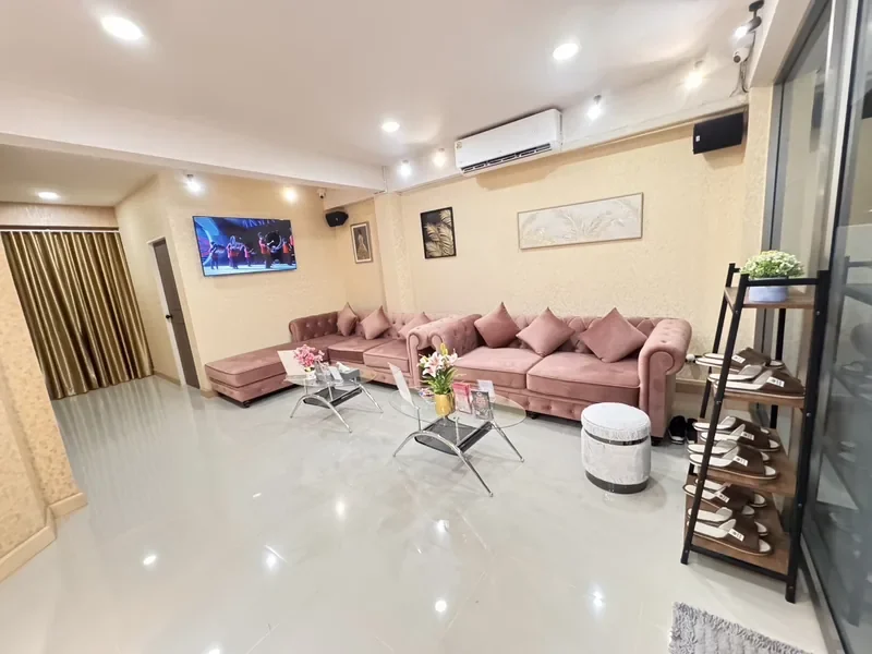 KK Club Khon Kaen lounge with pink velvet sofas and TV where guests choose from the model lineup