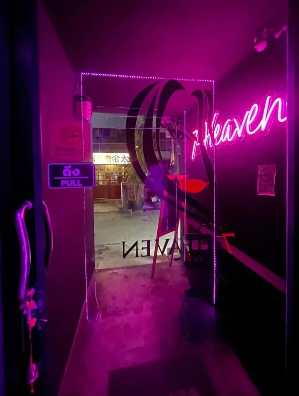 7-Heaven Bangkok pink signboard at the alley entrance off Sukhumvit Soi 33, Phrom Phong